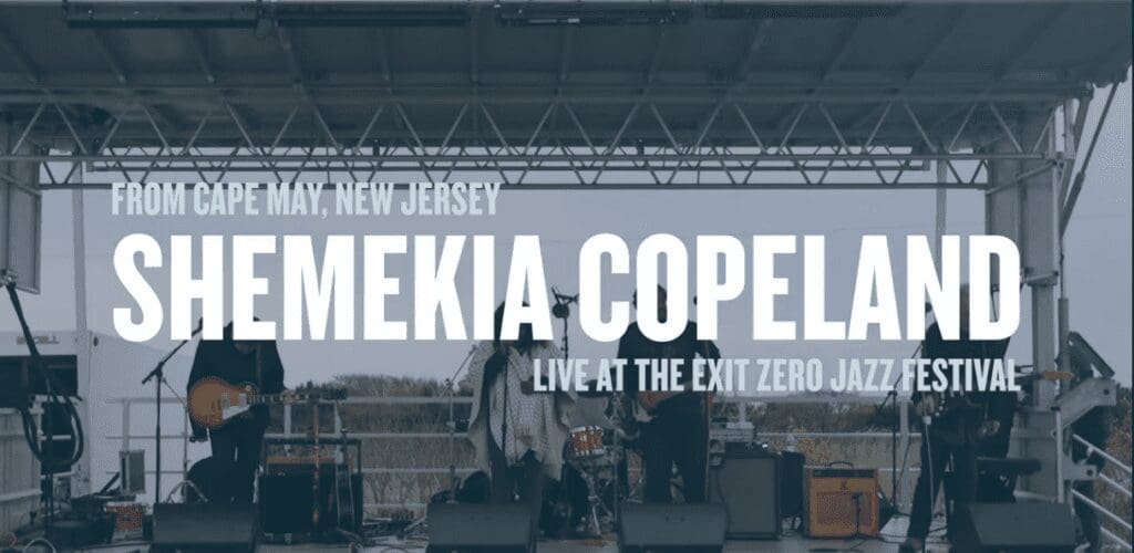A band is playing on stage at an event.